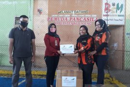 PPT RBBE salurkan APD ke pemuda pancasila Sijunjung