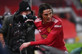 Diego Godin dan Luis Suarez  desak FA cabut skorsing Cavani