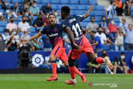 Gol injury time Thomas Lemar bawa Atletico Madrid atasi Espanyol 2-1