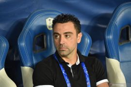 Xavi Hernandez buka pintu latih Barcelona