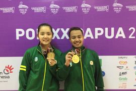 Menang WO, Jatim rebut emas bulu tangkis ganda campuran PON Papua