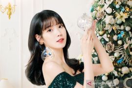 IU beri donasi besar jelang pergantian tahun