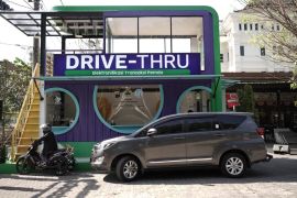Grab & OVO luncurkan layanan publik dan pajak "drive thru" pertama