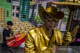 Braga melukis Payung Geulis