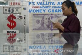 Rupiah melemah jadi Rp14.878 per dolar AS