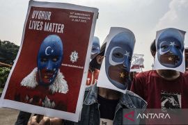 Aksi protes kekerasan terhadap muslim Uighur