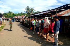 Kodim 1314/Gorontalo Utara karya bakti membersihkan pasar tradisional