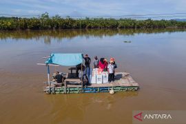 Distribusi logistik Pemilu ke Muara Sampara Page 2 Small