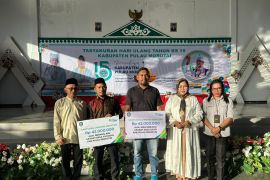 Pj Bupati Morotai  serahkan santunan BPJS Ketenagakerjaan kepada ahli waris aparat desa