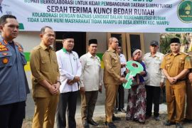 Implementasi Program Bubur Pedas bedah dua rumah warga Wampu