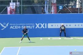 PON XXI: Tenis -  Rifqi fitriadi mampu main sesuai strategi meski usai cedera