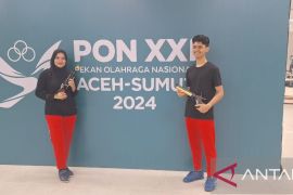 Menembak- medali emas terbayar lewat latihan setahun