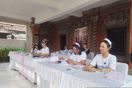 All-women team supports voting at Bali polling station