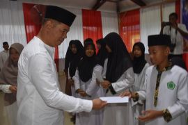 Kodim 1710 Mimika santuni anak yatim peringati Nuzulul Qur'an 1446 H