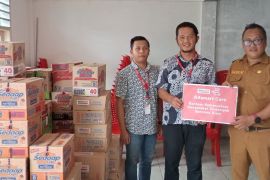Alfamart bantu korban bencana alam di Manado