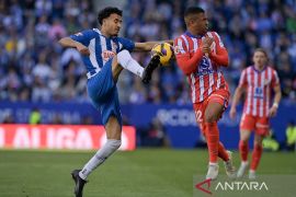 Atletico berada di posisi dua klasemen usai menang dramatis 2-1 di markas Sevilla