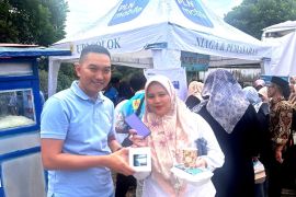 Solok Maimbau", PLN Kayu Aro meriahkan dengan bagikan paket makanan gratis dan promosikan PLN Mobile