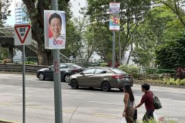 Partai PAP Lawrence Wong menang besar di pemilu Singapura