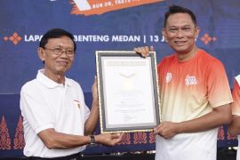 BMPD Medan raih rekor MURI  pelari beli kopi satu rupiah gunakan QRIS