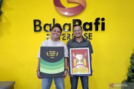 Baba Rafi raih penghargaan Mitra Juara GoFood 2024