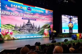 Minister calls for sustaining harmony at Buddhist conference