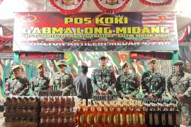 Satgas Pamtas RI-Malaysia Mengamankan Miras dan Munisi