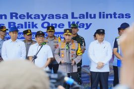 Indonesian police urge staggered Eid return with WFA