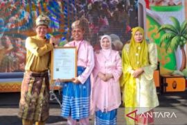 Kanwil Kemenkum Riau Hadiri Penyerahan Sertifikat KIK Tapai Pulut Katuk pada Milad ke-61 Kabupaten Indragiri Hilir