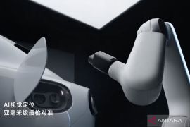 Xiaomi perkenalkan lengan robot untuk pengisian daya mobil listrik