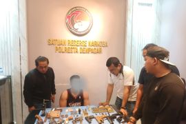 Bali police probe gun cache found in drug raid