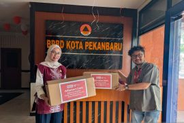 Peduli dampak asap karhutla, Alfamart Pekanbaru bagikan 1.500 masker untuk warga