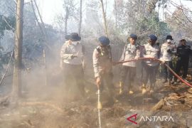 Wildfires - South Kalimantan police test starch-based fire suppressant