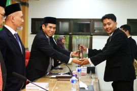 Dosen berpekerjaan sampingan sopir daring meraih gelar doktor UIN Semarang