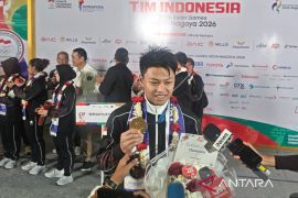 Lifter Rahmat Erwin mempersembahkan emas Asian Games bagi keluarga