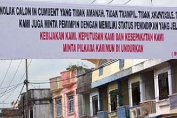 Spanduk Pelingkar:  Tunda Pilkada Karimun 
