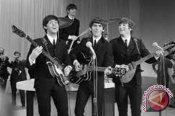 George Harrison dihadihai video "Here Come the Sun"