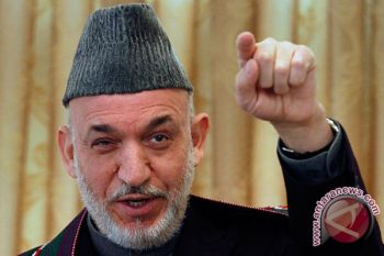 Presiden Karzai Janji Akan Mundur 2014