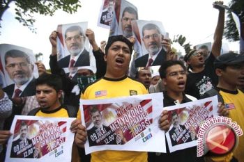 Qatar Desak Pembebasan Moursi