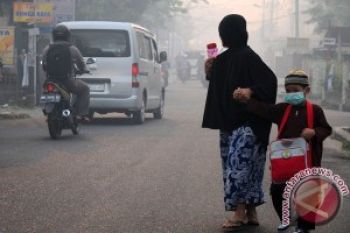  Pekanbaru Diserbu Asap, Ribuan Masker Dibagikan
