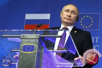Cameron-Putin Bertemu Untuk Pembicaraan Di Paris
