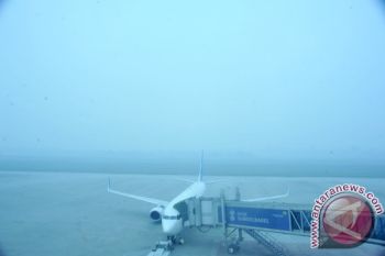 Penerbangan tertunda kabut