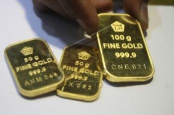 Emas naik tajam karena pernyataan FED tekan Dolar AS