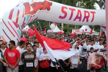 Ribuan Pelari Ramaikan "iloop Fun Run Telkomsel" 