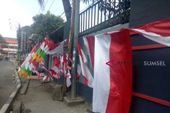 Penjual bendera coba peruntungan Asian Games