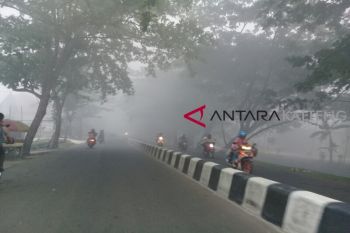 Warga Sampit gunakan masker dan nyalakan lampu kendaraan