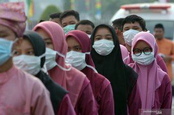 Takbir keliling di tengah kabut asap