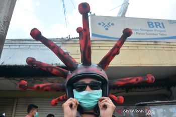 Cara Unik Sosialisasi Penggunaan Masker