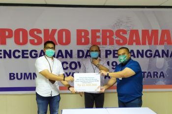 BNI wilayah Manado menyerahkan bantuan penanggulangan COVID-19
