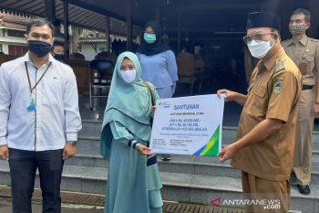 BPJAMSOSTEK Purwokerto serahkan  santunan ahli waris korban COVID-19