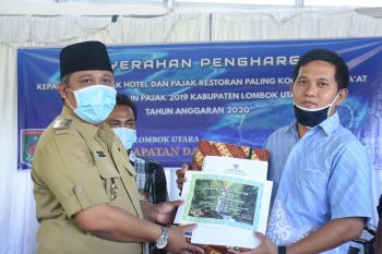 Plt Bupati Lombok Utara menghadiri penyerahan hadiah wajib pajak kooperatif